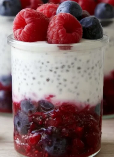 Berry & Chia Yogurt Parfait with fresh berries and chia seeds in a glass