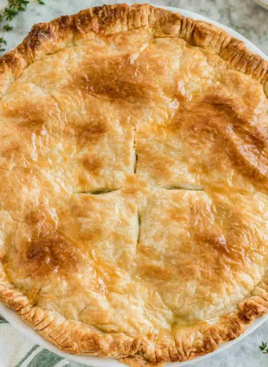 Cozy chicken pot pie with flaky crust and savory filling of chicken and vegetables