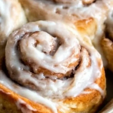 Freshly baked easy one hour cinnamon rolls topped with icing