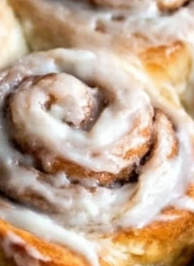 Freshly baked easy one hour cinnamon rolls topped with icing
