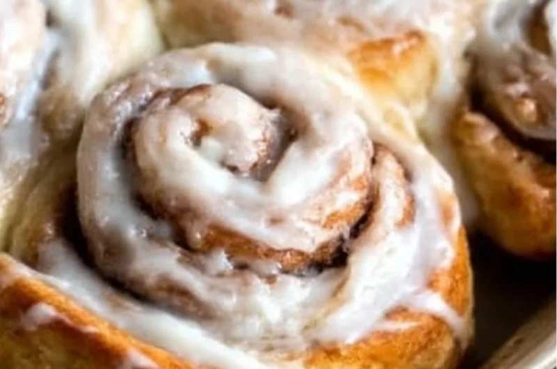 Freshly baked easy one hour cinnamon rolls topped with icing