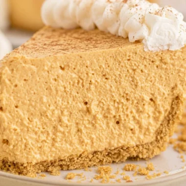 Delicious no-bake fluffy marshmallow pumpkin pie on a table