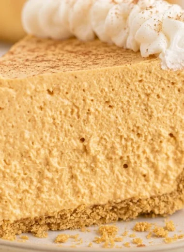 Delicious no-bake fluffy marshmallow pumpkin pie on a table