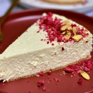 Gluten-free diabetic cheesecake slice topped with berries