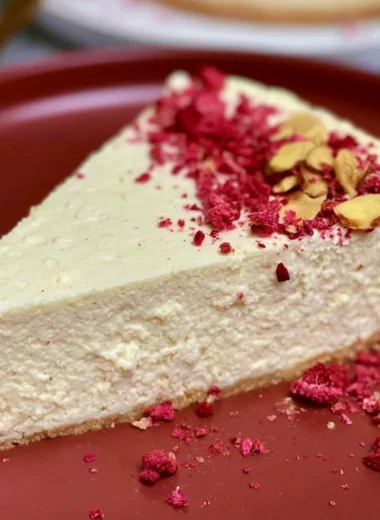 Gluten-free diabetic cheesecake slice topped with berries