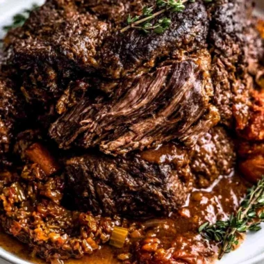 Delicious Ina Garten's Company Pot Roast served in a rustic bowl.