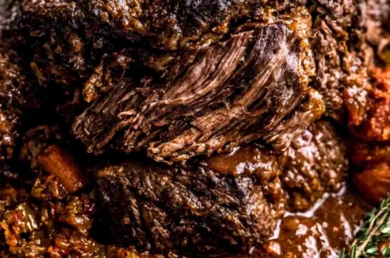 Delicious Ina Garten's Company Pot Roast served in a rustic bowl.