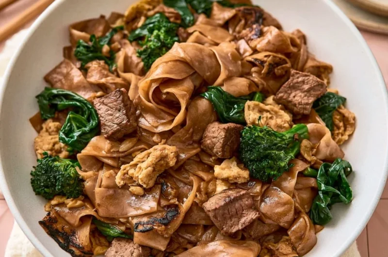 Delicious quick Thai stir-fry with colorful vegetables and chicken in a pan