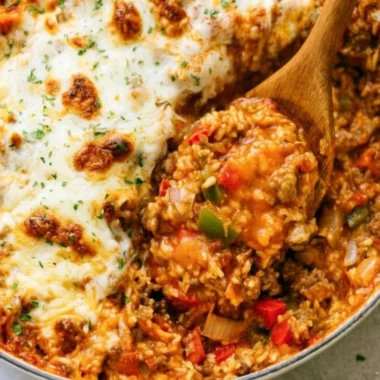 Delicious stuffed pepper casserole made with colorful bell peppers and savory filling.