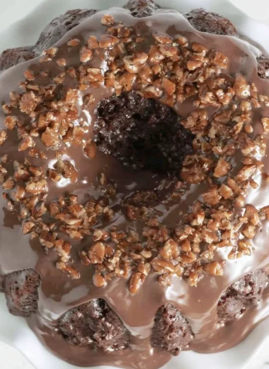 Texas Sheet Cake Bundt Cake showcasing a rich chocolate glaze and sprinkles.
