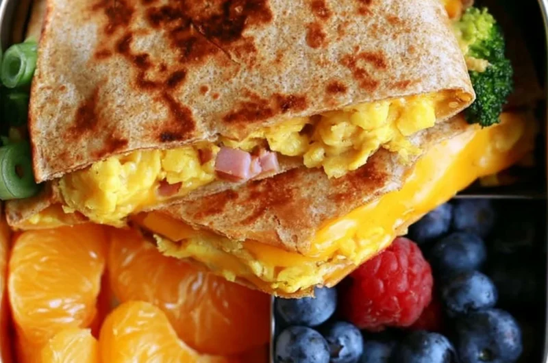 Delicious Breakfast Quesadilla served on a plate with fresh ingredients