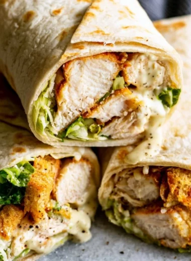 Cozy Chicken Caesar Wrap freshly made with lettuce, chicken, and Caesar dressing