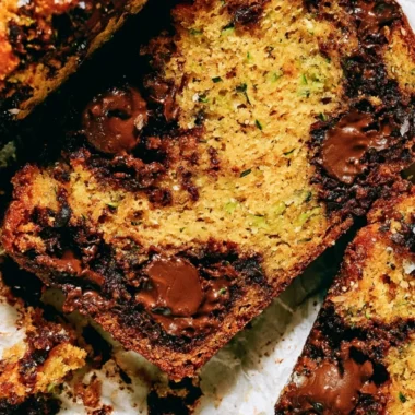 Loaf of cozy chocolate chip zucchini bread with chocolate chips on top