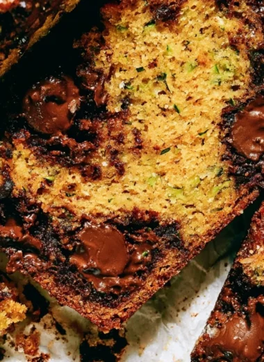 Loaf of cozy chocolate chip zucchini bread with chocolate chips on top