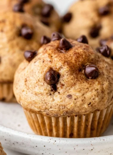 Cozy cottage cheese muffins with chocolate chips on a rustic table