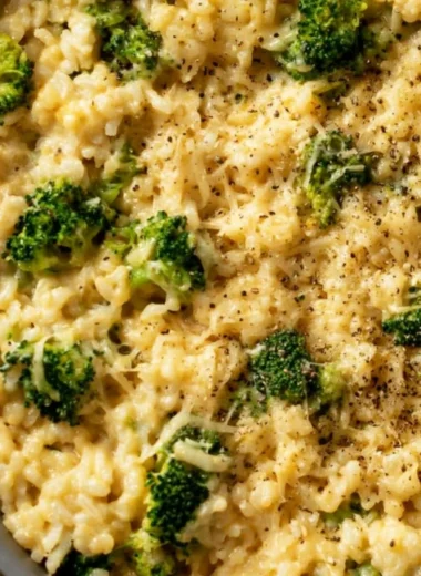 Creamy broccoli cheese rice served in a cozy dish, rich in flavor and nutrients.