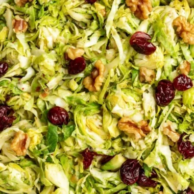 Cozy shaved Brussels sprouts salad with greens and toppings
