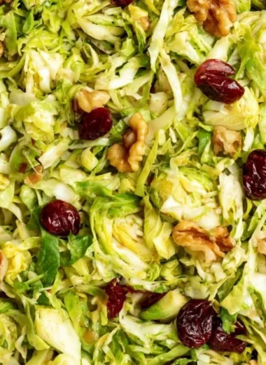 Cozy shaved Brussels sprouts salad with greens and toppings