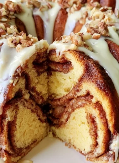 Delicious Easy Cinnamon Roll Bundt Cake topped with icing