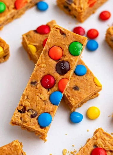 No-Bake Monster Cookie Protein Bars with oats, chocolate chips, and peanut butter