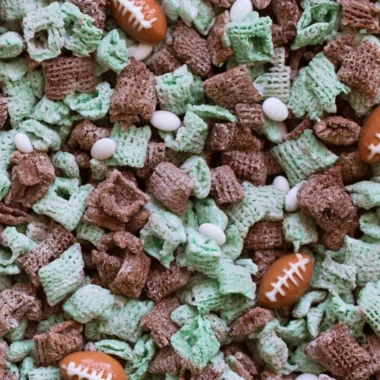 A playful puppy enjoying a bowl of Football Puppy Chow on game day.