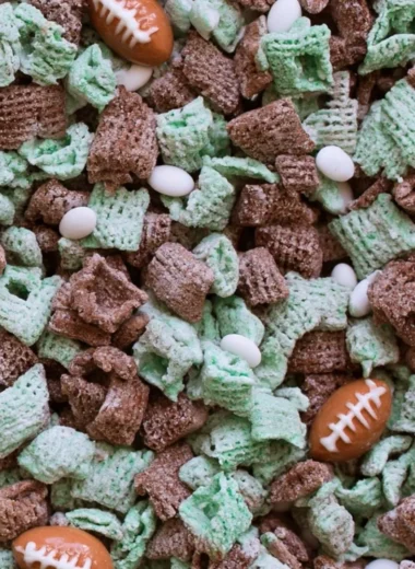 A playful puppy enjoying a bowl of Football Puppy Chow on game day.