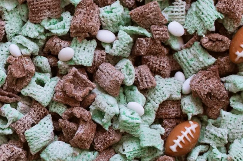A playful puppy enjoying a bowl of Football Puppy Chow on game day.