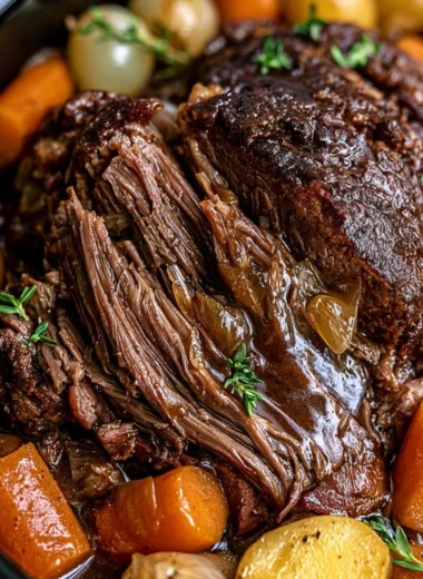 Cozy Crockpot pot roast served with vegetables and gravy.