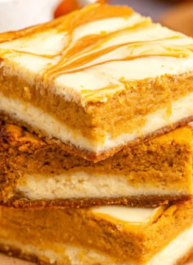 Cozy pumpkin cream cheese cheesecake bars served on a plate