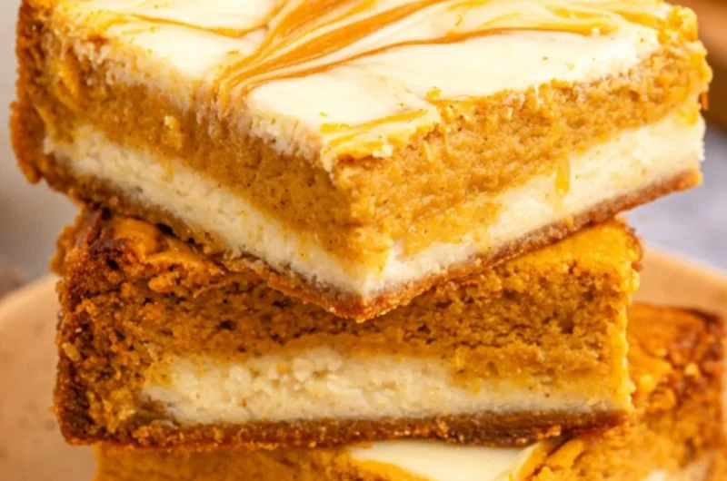 Cozy pumpkin cream cheese cheesecake bars served on a plate