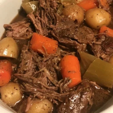 Delicious slow cooker pot roast with carrots and potatoes