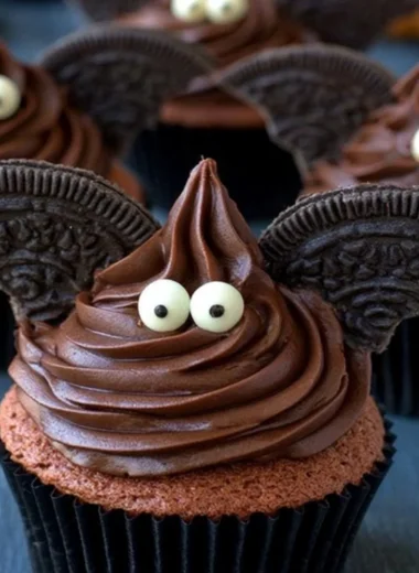 Halloween bat cupcakes decorated with chocolate frosting and candy eyes