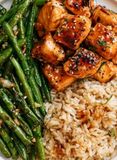 Honey Garlic Chicken served with green beans on a plate