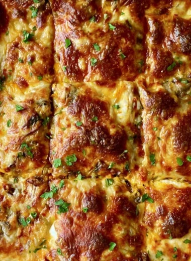 Delicious butternut squash lasagna with spinach and mushrooms baked to perfection.