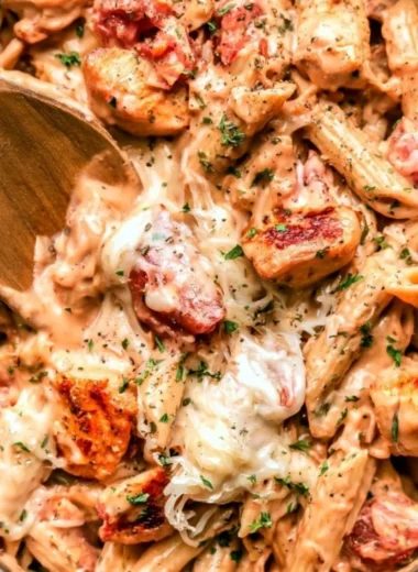 One Pot Chicken Pasta in a bowl, garnished with herbs and cheese for a cozy meal.