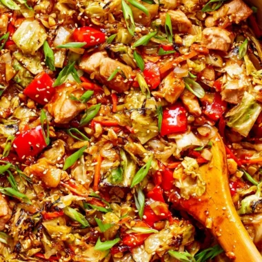 Colorful cabbage stir fry with vegetables in a wok