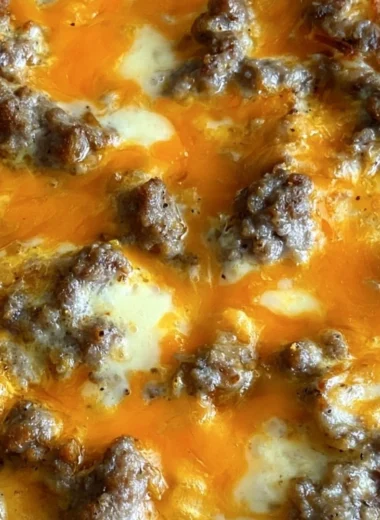 Delicious Christmas morning casserole topped with herbs and cheese