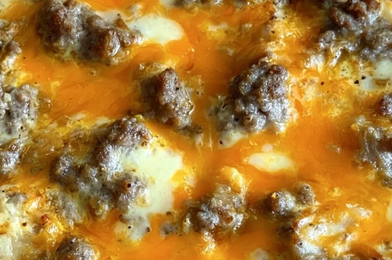 Delicious Christmas morning casserole topped with herbs and cheese