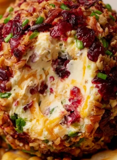 Cranberry Pecan Cheese Ball served with crackers and nuts