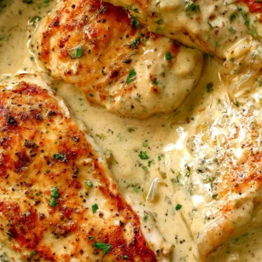 Creamy ranch chicken dish served on a plate with herbs and garnishes.