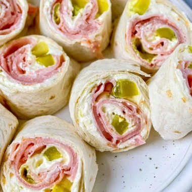 Delicious Pickle Dip Pinwheels displayed on a platter for a party snack