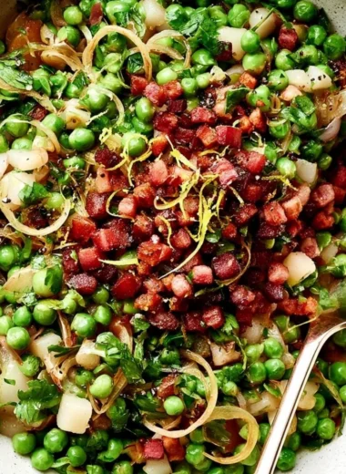 Thanksgiving peas side dish featuring vibrant green peas for the holiday meal.